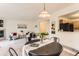 Open living area with dining, a cozy sitting area, and access to the kitchen at 1601 Great Western Dr # D3, Longmont, CO 80501