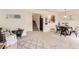 Open living room features stairs, dining area, and comfortable seating with an area rug at 1601 Great Western Dr # D3, Longmont, CO 80501
