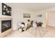Inviting living room with a fireplace, neutral carpet, cozy chairs, and tasteful decor at 1601 Great Western Dr # D3, Longmont, CO 80501