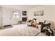 Bright living room with fireplace, area rug, comfortable seating and a front door at 1601 Great Western Dr # D3, Longmont, CO 80501