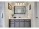 Well lit bathroom features a gray vanity with marble countertop and decorative lighting at 11533 Bent Oaks St, Parker, CO 80138