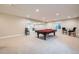 Spacious basement with a pool table, and ample room for entertaining at 3325 Yale Dr, Broomfield, CO 80023