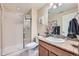 Bathroom featuring granite countertops, tiled floors, and a standing shower at 3325 Yale Dr, Broomfield, CO 80023