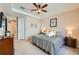 Bright bedroom featuring tan walls, ceiling fan, and comfortable furnishings at 3325 Yale Dr, Broomfield, CO 80023