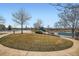 Community pool area with waterslides and picnic tables, perfect for Gathering fun and recreation at 3325 Yale Dr, Broomfield, CO 80023