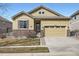 Charming single-Gathering home with a two-car garage, stone accents, and well-maintained front yard at 3325 Yale Dr, Broomfield, CO 80023