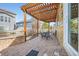 Outdoor patio with a pergola, brickwork, and space for outdoor dining at 3325 Yale Dr, Broomfield, CO 80023