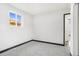 Well-lit bedroom with grey carpet and a window at 655 S Osceola St, Denver, CO 80219