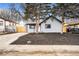 Newly renovated home with front yard and driveway at 655 S Osceola St, Denver, CO 80219