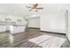 Modern kitchen with white cabinets and breakfast bar at 655 S Osceola St, Denver, CO 80219