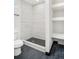 Clean bathroom with a walk-in shower and hexagon tile floor at 655 S Osceola St, Denver, CO 80219