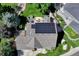Aerial view of home with solar panels, backyard deck, and lush backyard landscaping at 10142 Mountain Maple Dr, Highlands Ranch, CO 80129