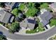 Aerial view of home with solar panels, deck, green yard, and landscaped walkway at 10142 Mountain Maple Dr, Highlands Ranch, CO 80129