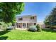 Well-maintained backyard features a pergola-covered patio and mature landscaping at 10142 Mountain Maple Dr, Highlands Ranch, CO 80129