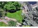 Aerial view showcasing the lush green lawn, deck, and landscaping of this property at 10142 Mountain Maple Dr, Highlands Ranch, CO 80129