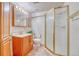 Well-maintained bathroom featuring a glass-enclosed shower, vanity, and tiled flooring at 10142 Mountain Maple Dr, Highlands Ranch, CO 80129