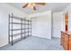 Bright bedroom featuring a ceiling fan and storage shelves, perfect for organizing belongings at 10142 Mountain Maple Dr, Highlands Ranch, CO 80129