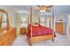 A traditional bedroom features a four-poster bed and matching wood furniture at 10142 Mountain Maple Dr, Highlands Ranch, CO 80129