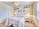 A bright bedroom with shelves has a window letting in natural light at 10142 Mountain Maple Dr, Highlands Ranch, CO 80129