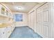 Versatile bonus room with built-in cabinets and a window for natural light at 10142 Mountain Maple Dr, Highlands Ranch, CO 80129