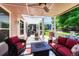 Relax on this covered patio featuring comfortable seating and a cozy fire pit table at 10142 Mountain Maple Dr, Highlands Ranch, CO 80129