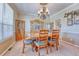 Elegant dining room featuring wooden furniture, chandelier, and crown molding at 10142 Mountain Maple Dr, Highlands Ranch, CO 80129