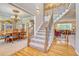 Inviting entryway with hardwood floors, staircase, and view of the dining room and living room at 10142 Mountain Maple Dr, Highlands Ranch, CO 80129