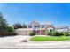Charming two-story home featuring a well-manicured lawn, three car garage, and inviting entrance at 10142 Mountain Maple Dr, Highlands Ranch, CO 80129
