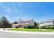 A beautiful home with lush landscaping on a sunny day at 10142 Mountain Maple Dr, Highlands Ranch, CO 80129