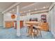 Fun game room with table, chairs, bar, and jukebox; ideal for entertaining guests at 10142 Mountain Maple Dr, Highlands Ranch, CO 80129