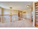A well-lit hallway features a decorative chandelier and hardwood accents at 10142 Mountain Maple Dr, Highlands Ranch, CO 80129