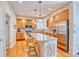 Updated kitchen features stainless steel appliances, an island, and ample cabinet space at 10142 Mountain Maple Dr, Highlands Ranch, CO 80129