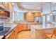 Well-appointed kitchen with an island, modern appliances, and plenty of counter space at 10142 Mountain Maple Dr, Highlands Ranch, CO 80129