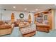 Inviting living room with cozy furniture, including sofas, chairs, and a decorative bear-themed ottoman at 10142 Mountain Maple Dr, Highlands Ranch, CO 80129