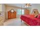 Spacious main bedroom featuring wooden furniture, ceiling fan, and carpeted floors at 10142 Mountain Maple Dr, Highlands Ranch, CO 80129