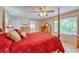 Bright main bedroom featuring wooden furniture, large bed, and natural light at 10142 Mountain Maple Dr, Highlands Ranch, CO 80129
