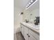 Well-lit bathroom featuring a tub and shower, a double sink, and modern gray flooring at 14129 E Dickinson Dr # D, Aurora, CO 80014