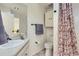 Bright bathroom featuring a vanity and a shower with a floral curtain at 14129 E Dickinson Dr # D, Aurora, CO 80014