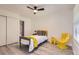 Bright bedroom with wood floors, ceiling fan, closet, and fun accents at 14129 E Dickinson Dr # D, Aurora, CO 80014