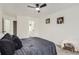 Bedroom featuring comfortable carpeting and a bright window at 14129 E Dickinson Dr # D, Aurora, CO 80014