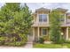 Inviting home featuring an exterior elevation with lush landscaping and a well-manicured lawn at 14129 E Dickinson Dr # D, Aurora, CO 80014
