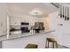 Well-appointed kitchen featuring stainless steel appliances, granite counters, and eat in counter seating at 14129 E Dickinson Dr # D, Aurora, CO 80014