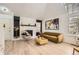 Stylish living room featuring wood floors, modern decor, and a charming fireplace at 14129 E Dickinson Dr # D, Aurora, CO 80014