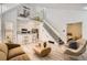 Open concept living room with a loft, seamless flow to the kitchen, and modern decor at 14129 E Dickinson Dr # D, Aurora, CO 80014
