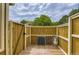Private patio space with wooden fence and a view of the sky at 14129 E Dickinson Dr # D, Aurora, CO 80014