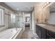 Bathroom with soaking tub, shower, and double vanity at 2633 Garganey Dr, Castle Rock, CO 80104