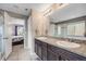 Main bathroom with double sinks and a shower at 2633 Garganey Dr, Castle Rock, CO 80104