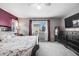 Bedroom with a large bed, dresser and a view of the neighborhood at 2633 Garganey Dr, Castle Rock, CO 80104