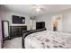 Main bedroom with large bed, dresser and en-suite bathroom at 2633 Garganey Dr, Castle Rock, CO 80104