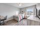 Bedroom with a wood-toned bed frame and window at 2633 Garganey Dr, Castle Rock, CO 80104